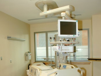 white hospital bed near white wall